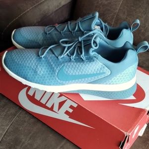 Women's Nike CK racer 9.5 women's shoes light blue with white sole.